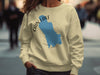 Light yellow crewneck sweatshirt with blue Cain Lake outline and compass design.