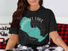 Black t-shirt with Sandhill Lake, Wisconsin map and compass design.