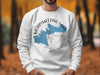 White sweatshirt with blue Merrymeeting Lake map and compass design.