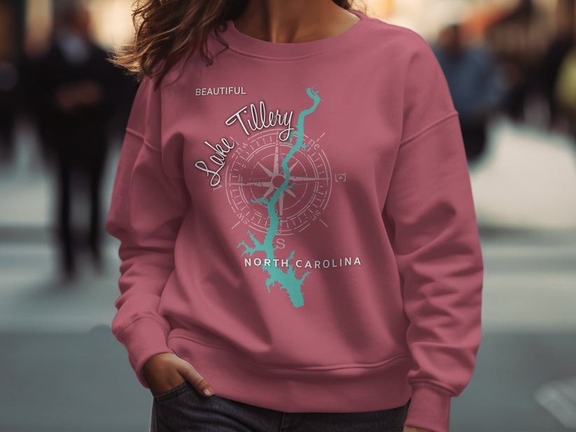 Pink sweatshirt with "Beautiful Lake Tillery North Carolina" text and compass graphic.