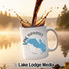 White mug with Lake Wawasee Indiana design, coffee pouring into it.