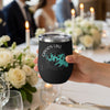 Black tumbler with Canyon Lake map and compass design, held by a hand.