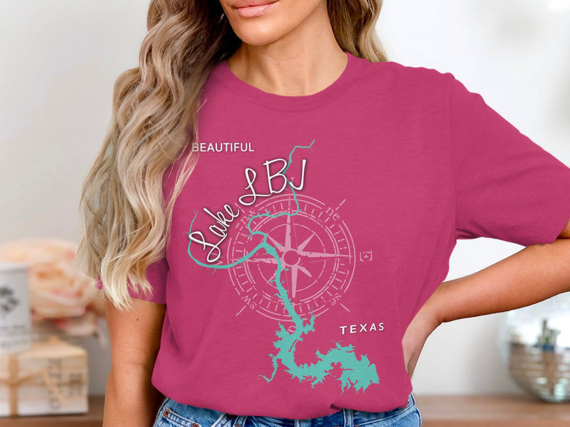 Woman wearing pink t-shirt with Lake LBJ map and compass design, Texas.