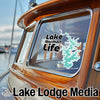 Lake Norman Life decal and Lake Lodge Media logo on a boat window.