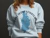 Light blue sweatshirt with "Lake Derwentwater England" map graphic and compass rose design.