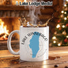 White mug with "Lake Winnebago Wisconsin" design and splashing coffee.