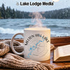 White mug with "Melton Hill Lake Tennessee" and compass design, steam rising.