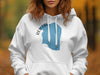 White hoodie with blue Red Lake, Minnesota graphic and text.