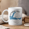 White mug with Grenada Lake Mississippi map and compass design.