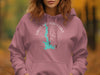 Pink hoodie with a compass and state outline of Texas graphic.
