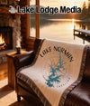 Woven blanket with Lake Norman, North Carolina map design on leather sofa.