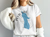 White t-shirt with blue Peyto Lake outline, compass, and "Banff" text.