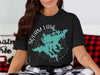 Black t-shirt with "Squam Lake New Hampshire" map and compass design.