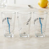 Three clear glasses with Seneca Lake map and compass design.