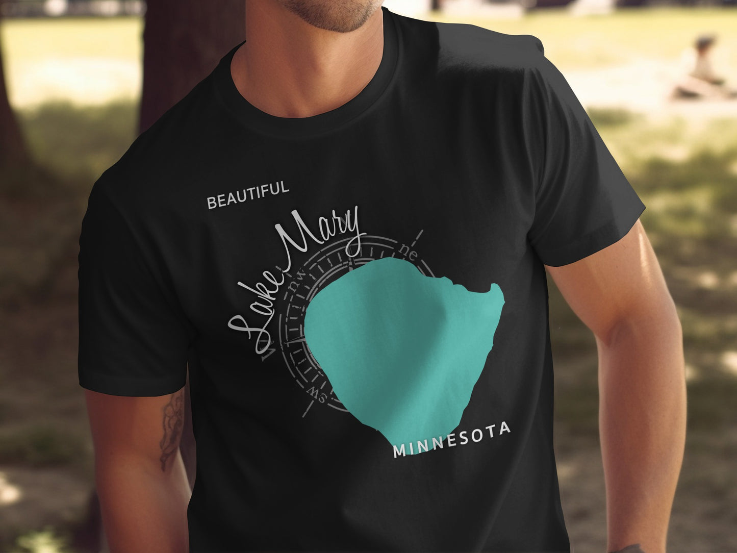 Black t-shirt with teal Lake Mary map and "Beautiful Minnesota" text.