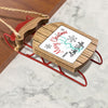 Wooden sled ornament with red runners and rope, "Merry Christmas FROM Lake Wylie" text.