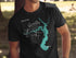 Black t-shirt with turquoise Lake Houston map and compass design.