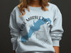 Light blue sweatshirt with Lake Marble Falls Texas map and compass design.