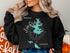 Black sweatshirt with a teal map of Lake Disharoon, Georgia and compass rose graphic.