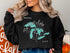 Black sweatshirt with "The Great Lakes" map and compass graphic.