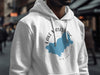 White hoodie with blue Lake Mascuppic map and compass graphic.