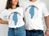 White t-shirts with "Lake Winnebago Missouri" map design and compass graphic.