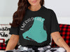 Black t-shirt with Emerald Lake shape graphic and compass design and "CANADA" text.