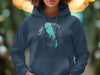 Navy blue hoodie with a turquoise map of Lake Winnipeg and a compass design.