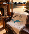 Woven blanket with Shoal Lake map, compass, and "Ontario" text.