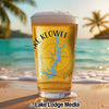 Beer glass with "Lake Keowee" and Georgia map design on beach.