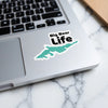 Sticker showing "Big Bear Life" over a teal outline of Big Bear Lake on a laptop.