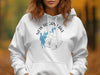 White hoodie with "New Hogan Lake California" map and compass design.