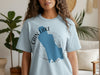 Light blue t-shirt with a blue map of Cain Lake, Washington and compass graphic.