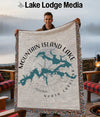 Man holding a woven blanket with a map of Mountain Island Lake, North Carolina.