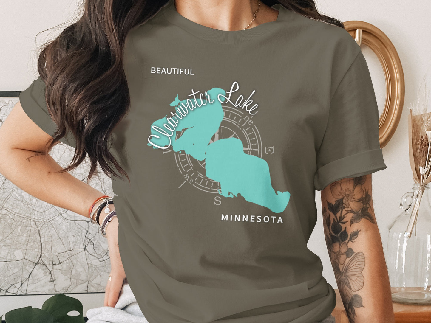 Olive green t-shirt with turquoise Clearwater Lake map and compass graphic.