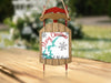 Ornament depicting a red sled with a "Merry Christmas From Lake Cecil M. Hardee" message.