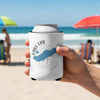 White can cooler held on a beach with Lake Erie and compass graphic.