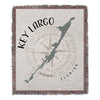 Woven blanket with Key Largo map outline and compass rose, reading "KEY LARGO FLORIDA".