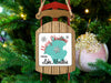 Sled ornament with "Merry Christmas From Lake Moultrie" text on teal map.