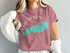 Pink t-shirt with white Lake Ontario map graphic and compass details.