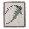 Woven blanket featuring Lake Las Vegas map and compass rose design with "Nevada" text.