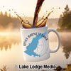 White mug with "Ross Barnett Lake Mississippi" design, coffee splashing.