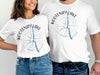 White t-shirts with Kootenay Lake map and compass design.