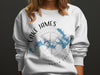 White sweatshirt with Lake James map and compass design. North Carolina.