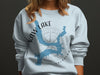 Light blue sweatshirt with "KAW LAKE OKLAHOMA" and blue lake outline graphic.