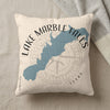 Pillow with Lake Marble Falls Texas map, compass, and text.