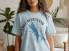 Light blue t-shirt with Lake Berryessa California map and compass graphic.