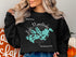Black crewneck sweatshirt with Lake Minnetonka map and text.