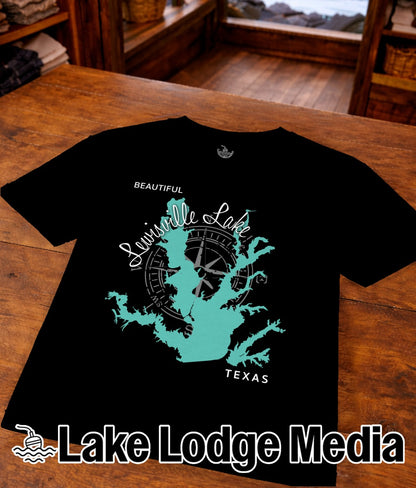 Black t-shirt with turquoise lake outline and compass rose graphic, "TEXAS" text.