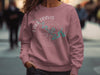Lake Travis Texas compass graphic on a dusty rose sweatshirt.